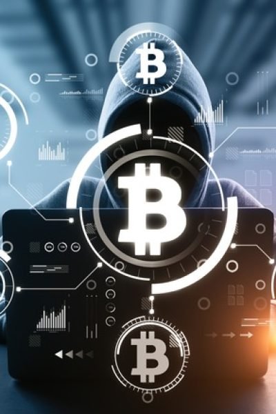 Front,View,Of,Hacker,In,Blurry,Interior,Using,Computers,At